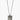 amulet necklace features a single inset ruby on a hand forged and beaten sterling silver dog tag, measuring .75"x 1.25”. it hangs from a sterling ball chain disrupted by a 1" bar