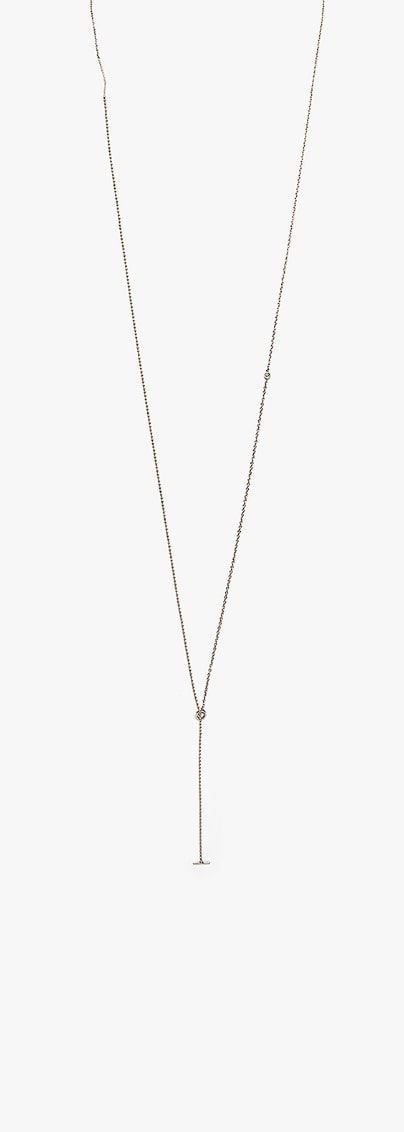 A white gold bar and a single cognac diamond stud suspend from a flat cable and bead chain. this piece can be worn as a long necklace or as a double wrap choker. Each piece is constructed in our lower east side studio using reclaimed 18k gold.
