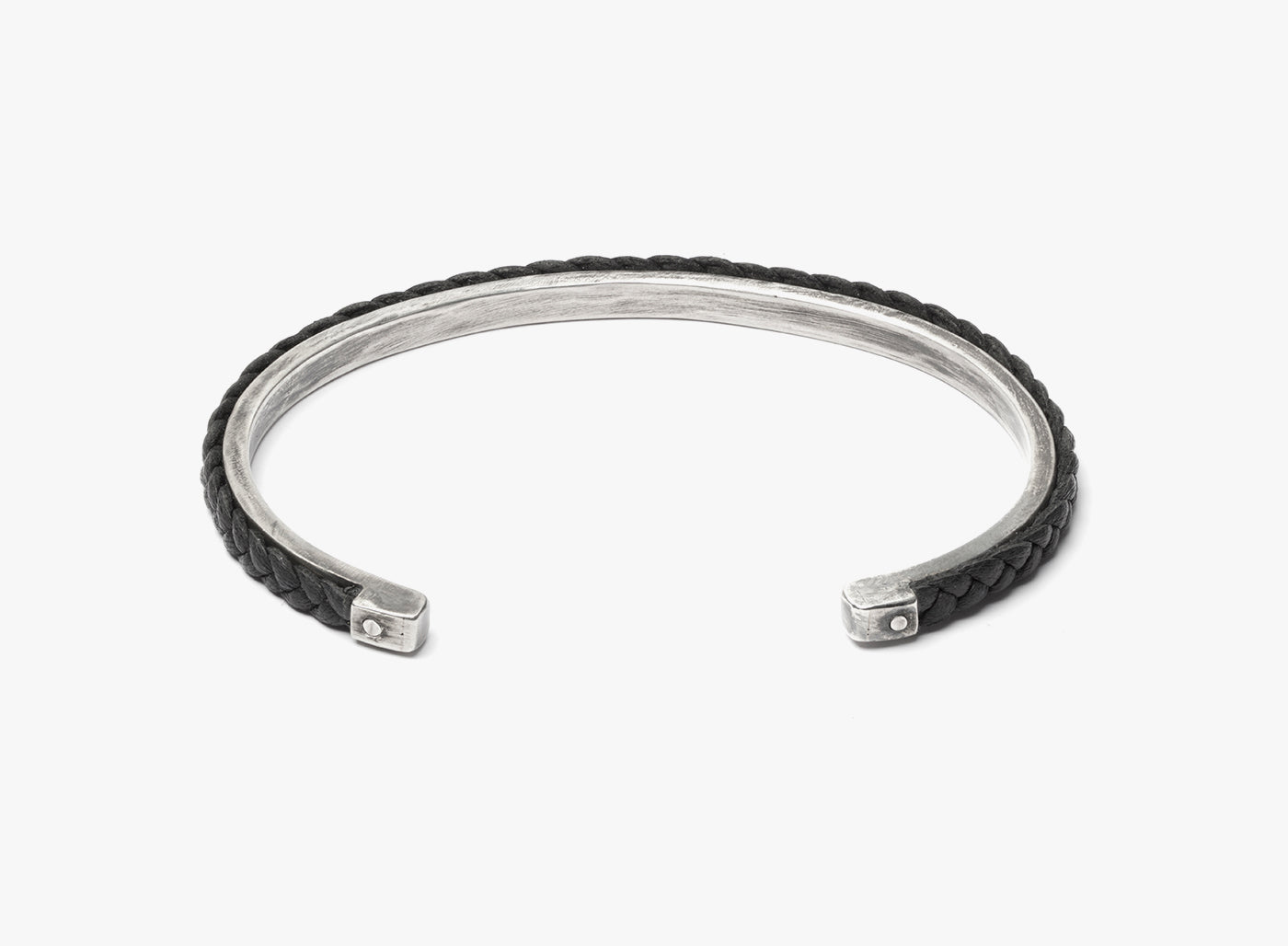 LEATHER BRACELET 123: the dichotomy of firm & malleable is featured in this hand-braided napa leather that is riveted onto a 1/8" solid sterling cuff