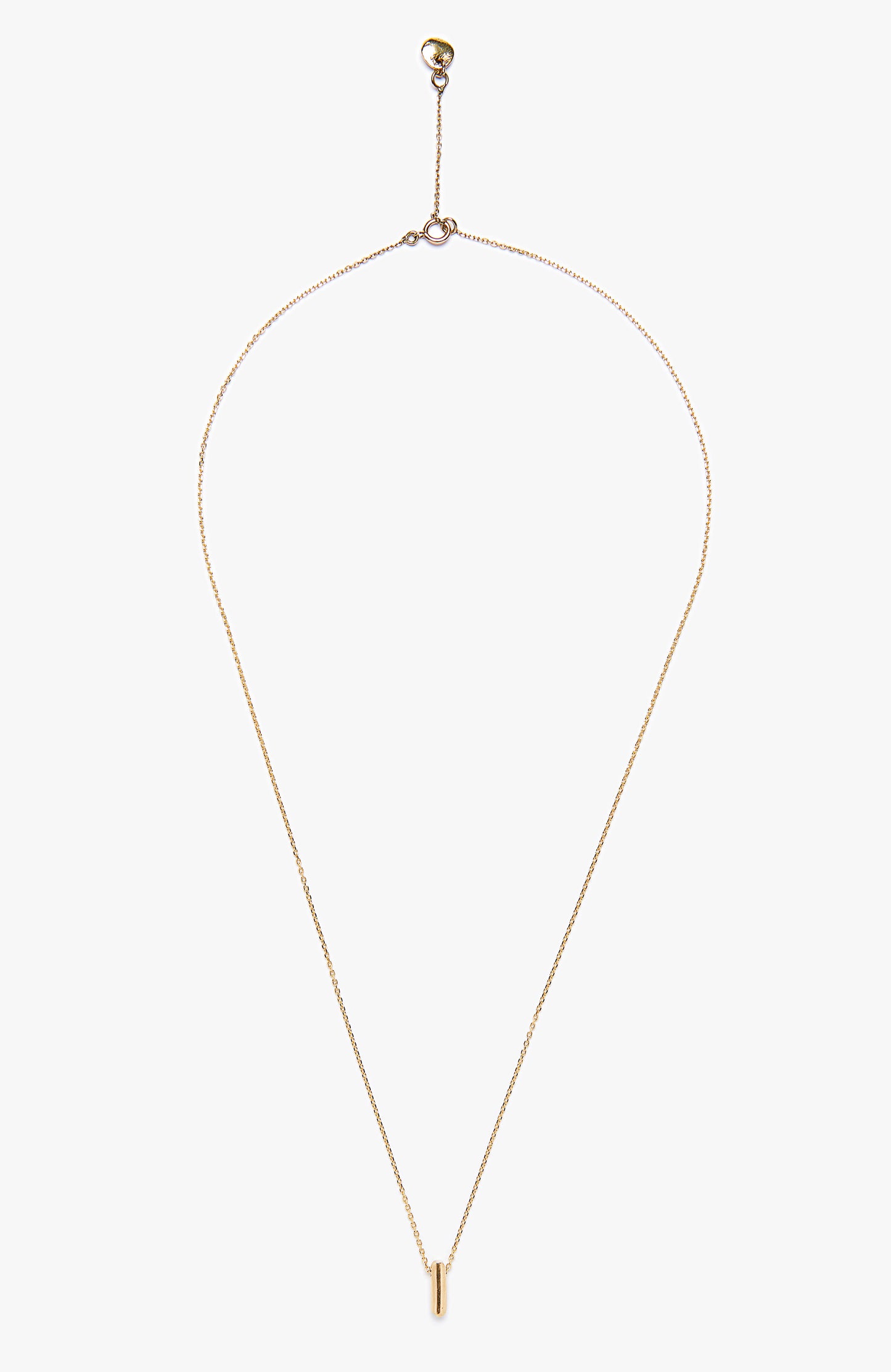an 18k gold bar hangs from a flat cable chain and is finished with a signature thumbprint amulet. it is constructed in our lower east side studio using reclaimed 18k gold. Each piece is constructed in our lower east side studio using reclaimed 18k gold.