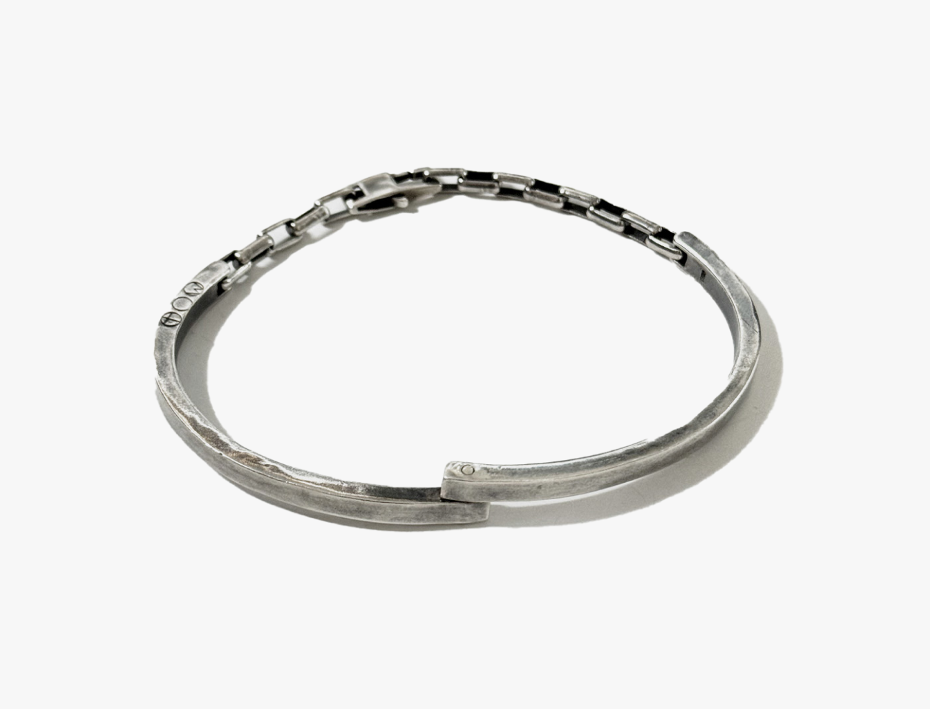 pivoting double hinged half cuff is connected by elongated box links and finished with a carabiner lobster clasp