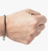 adjustable pyrite stone bracelet is finished with a signature single ruby