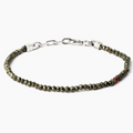 adjustable pyrite stone bracelet is finished with a signature single ruby