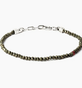 adjustable pyrite stone bracelet is finished with a signature single ruby