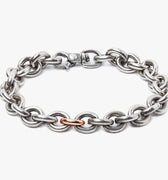 adjustable bracelet features large solid sterling cable links and a single 18k rose gold link detail