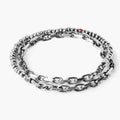 adjustable double wrap bracelet features a strand of sterling beads that connect to a solid cable chain and is finished with our signature ruby