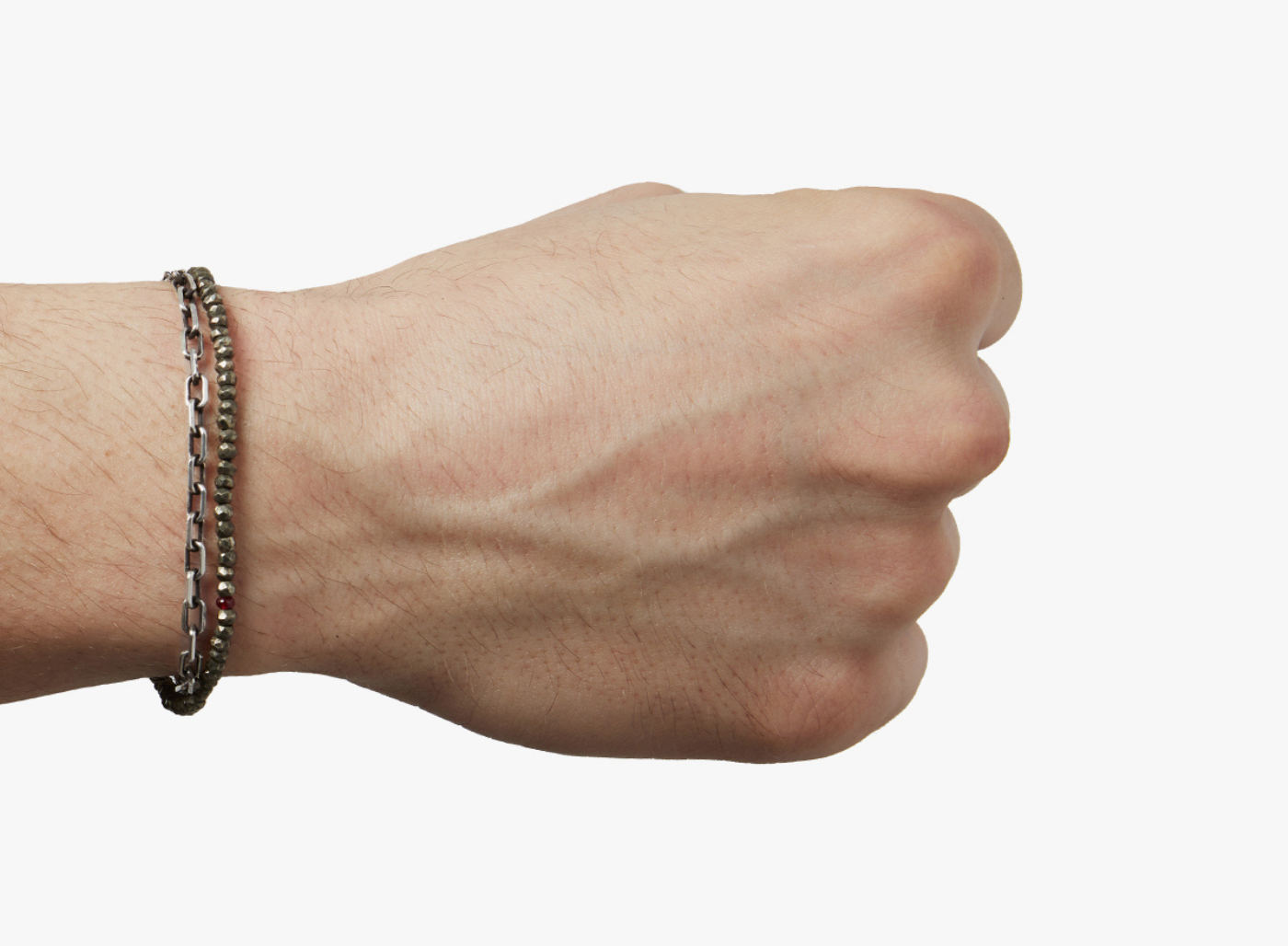 adjustable double wrap bracelet features a strand of pyrite stones that are disrupted by our signature ruby, and connects to an anchor chain