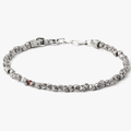 asymmetrical sterling beads are disrupted by a single ruby on this adjustable bracelet