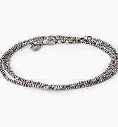 adjustable, multi wrap bracelet features micro sterling asymmetrical chips and is finished with a single ruby and thumbprint detail