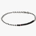 adjustable solid sterling ball chain connects to a strand of onyx stones and is finished with a single ruby