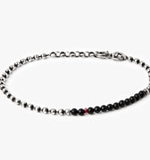 adjustable solid sterling ball chain connects to a strand of onyx stones and is finished with a single ruby