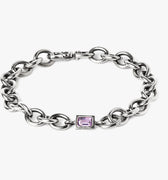 sterling silver bracelet features a cable chain with an emerald-cut amethyst centerpiece