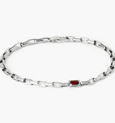 adjustable bracelet features a single offset emerald-cut garnet that sits along a sterling box chain