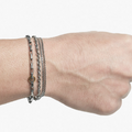 signature multi wrap bracelet features varying sterling chains that are offset with an 18k gold ring