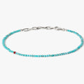 adjustable turquoise stone bracelet is finished with a signature single ruby