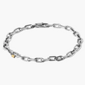 sterling silver anchor chain bracelet features an 18k gold tube detail that wraps around a link