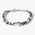 sterling silver bracelet combines a large link diamond cut cable chain with a distressed sterling silver rectangle, accented by an 18k gold hoop