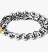 adjustable triple wrap bracelet features three types of sterling silver chain with an 18k gold accent piece