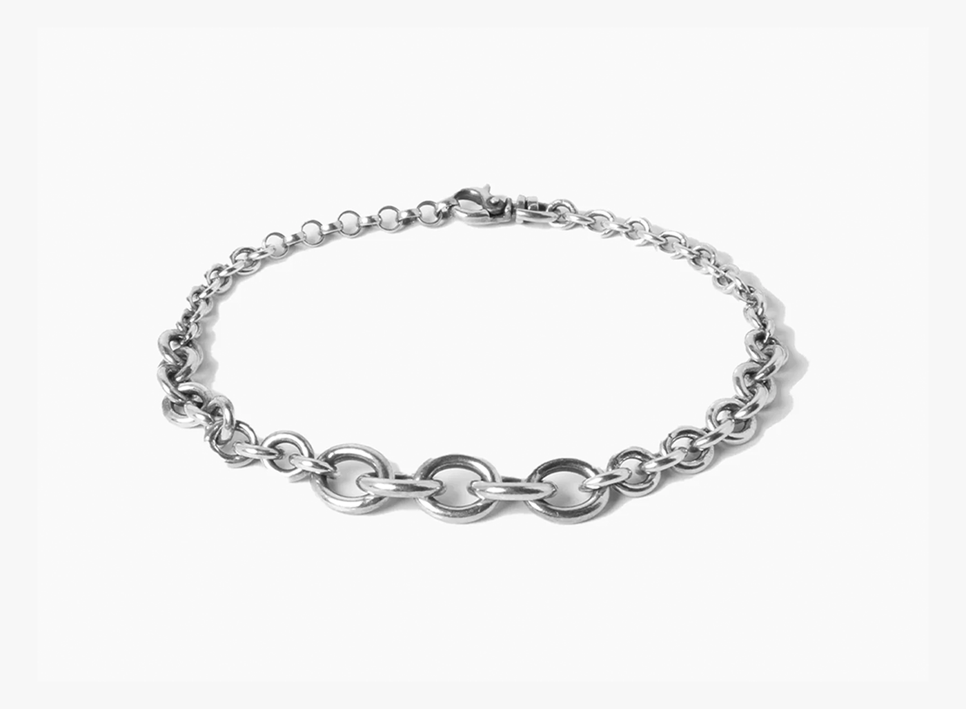 sterling silver bracelet combines three sizes of round cable chain