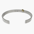 8mm x 2mm sterling silver cuff has been hand-forged and finished with a single 18k gold hoop