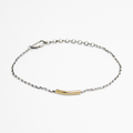 adjustable bracelet features a hand forged .75" 18k gold tube that sits along a sterling silver bead chain