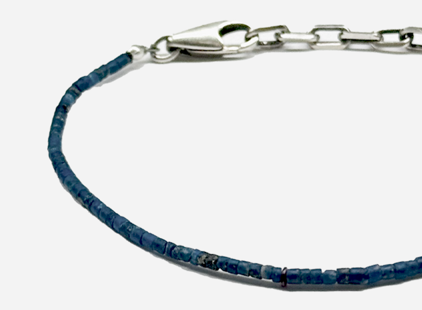 adjustable beaded lapis lazuli bracelet is finished with a signature single ruby