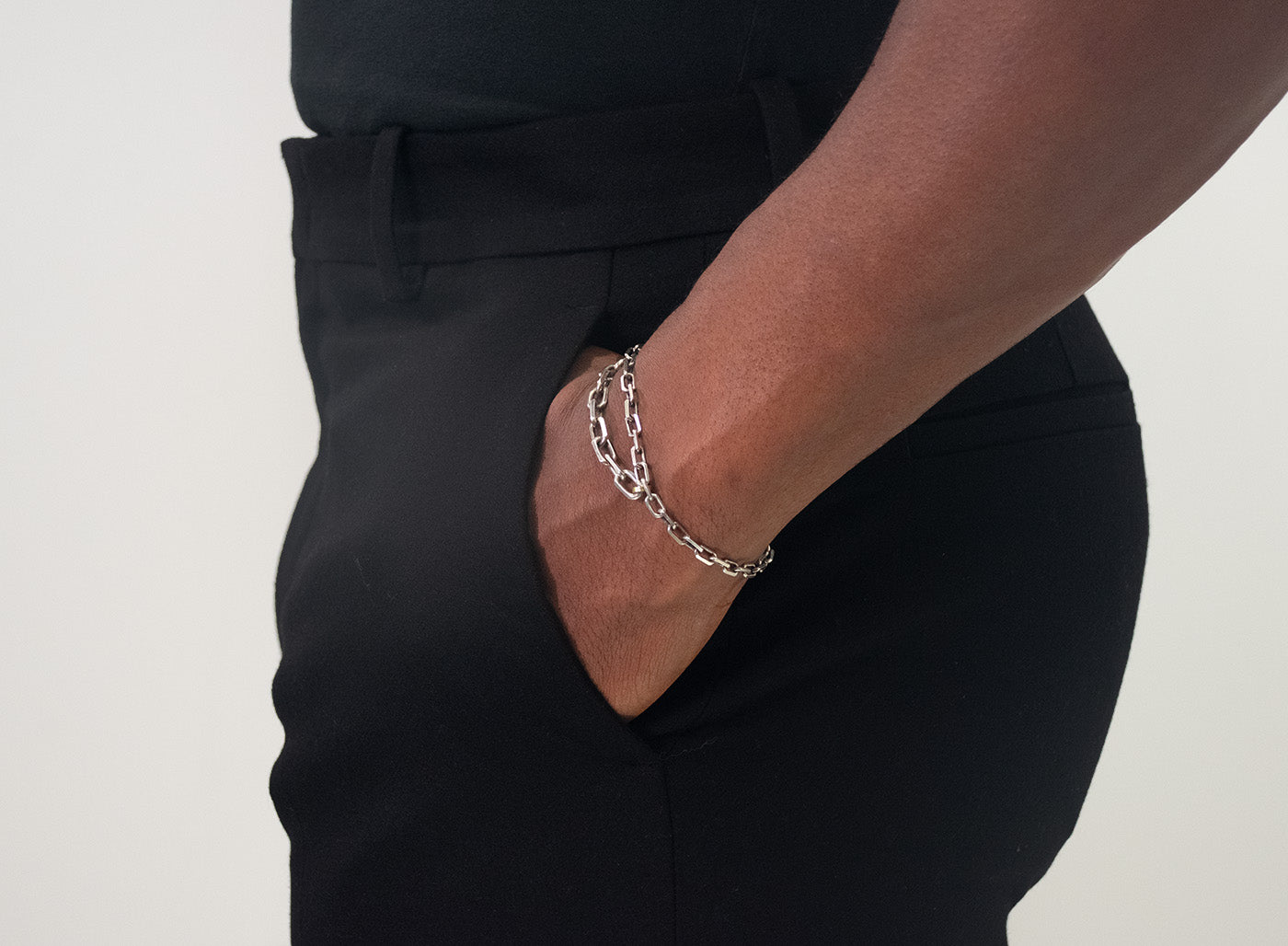 it is constructed in our lower east side studio using reclaimed sterling silver, which is then is oxidized - resulting in a darkened finish that will wear over time to a lighter, contrasting patina
