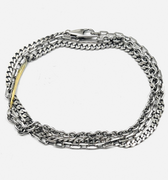 mixed chain multi wrap bracelet consists of an anchor, curb and cable link and is finished with an 18k flat gold bar