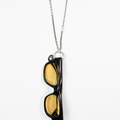 this sunglass holder is made of sterling silver and features varying cable chains broken up by a sterling silver bar and a sterling silver jump ring