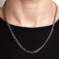 mixed chain sterling silver necklace by title of work, made up of a single diamond cut cable chain and double strand curb chain