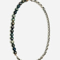 choker features a strand of 8.5mm grade a black tahitian pearls that connect to a round cable chain