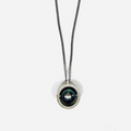 8mm tahitian pearl rotates lightly in this sterling half moon frame.. it suspends from a curb chain that is disrupted by a 1" bar