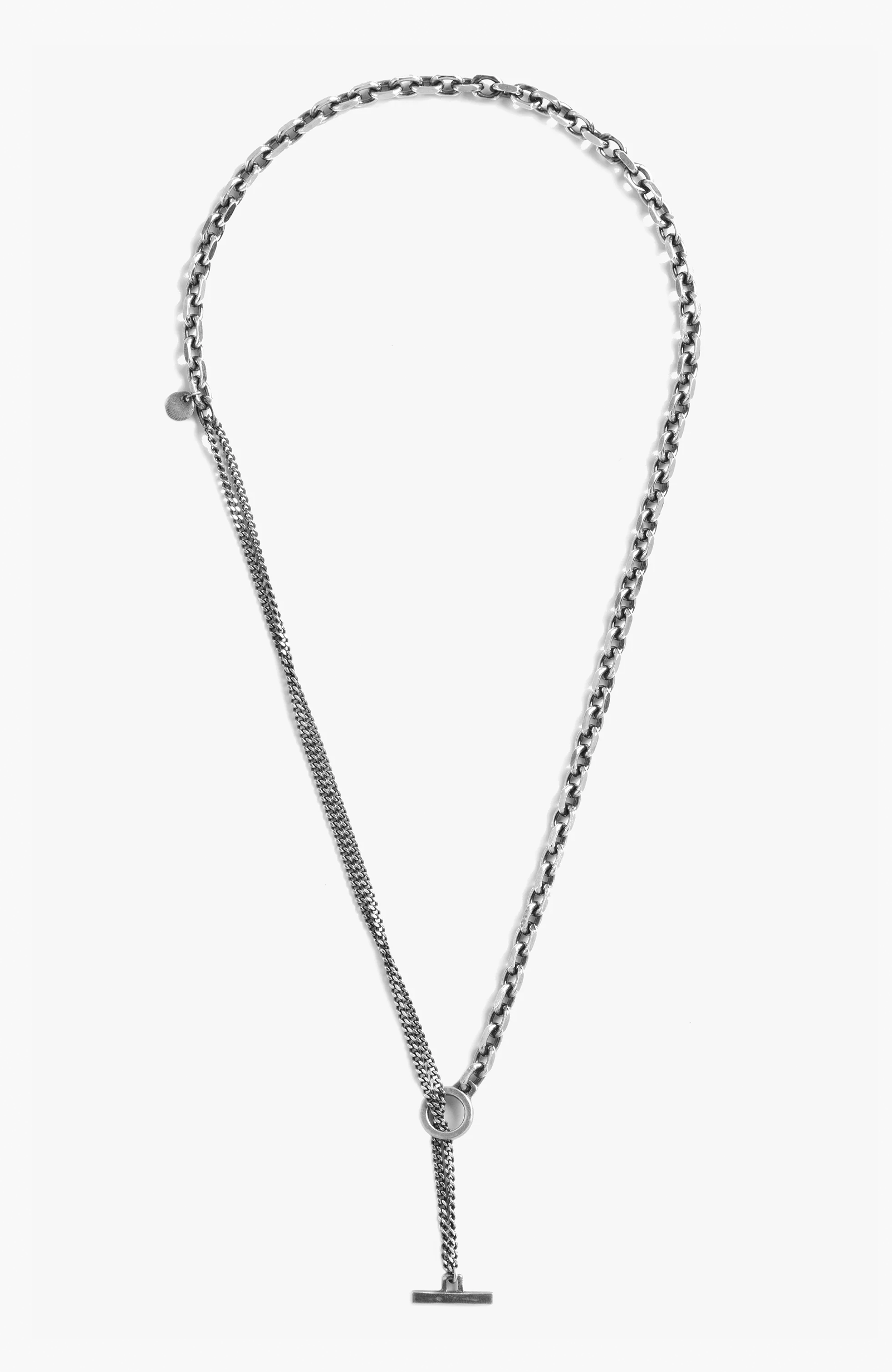 sterling necklace features a contrasting diamond cut cable link that connects to a curb chain. it is finished with a toggle and bar closure and our sterling thumbprint detail.