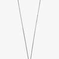 delicate curb chain necklace features a slim sculpted bar accent and an etched silver charm