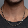 dense necklace features three varying sterling chains: a cable link, box link, and rolo link as well as a sterling silver bar