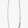 adjustable multi-chain necklace features elongated paperclip, cable, and diamond cut link chains