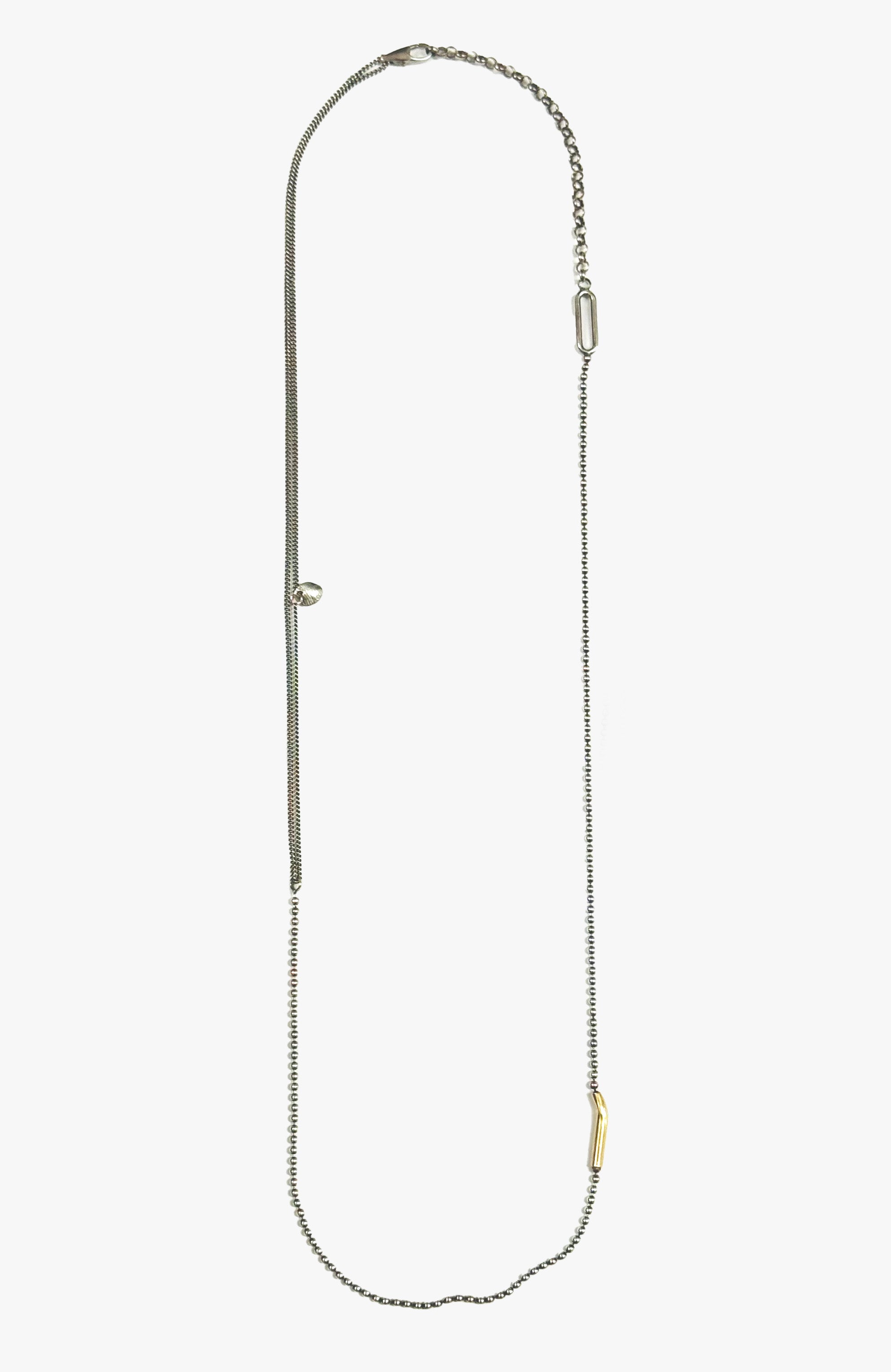 necklace is composed of a hand forged 1" solid 18k yellow gold bar that suspends from a sterling lariat and ball chain