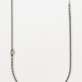 sterling silver necklace features varying ball and cable chains and is broken up by a sterling silver bar and 18k gold jump ring