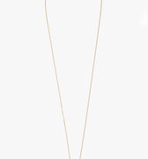 one inch solid 18k gold rod suspends from an ball chain disrupted by a solid bar. it is finished with our signature thumbprint detail