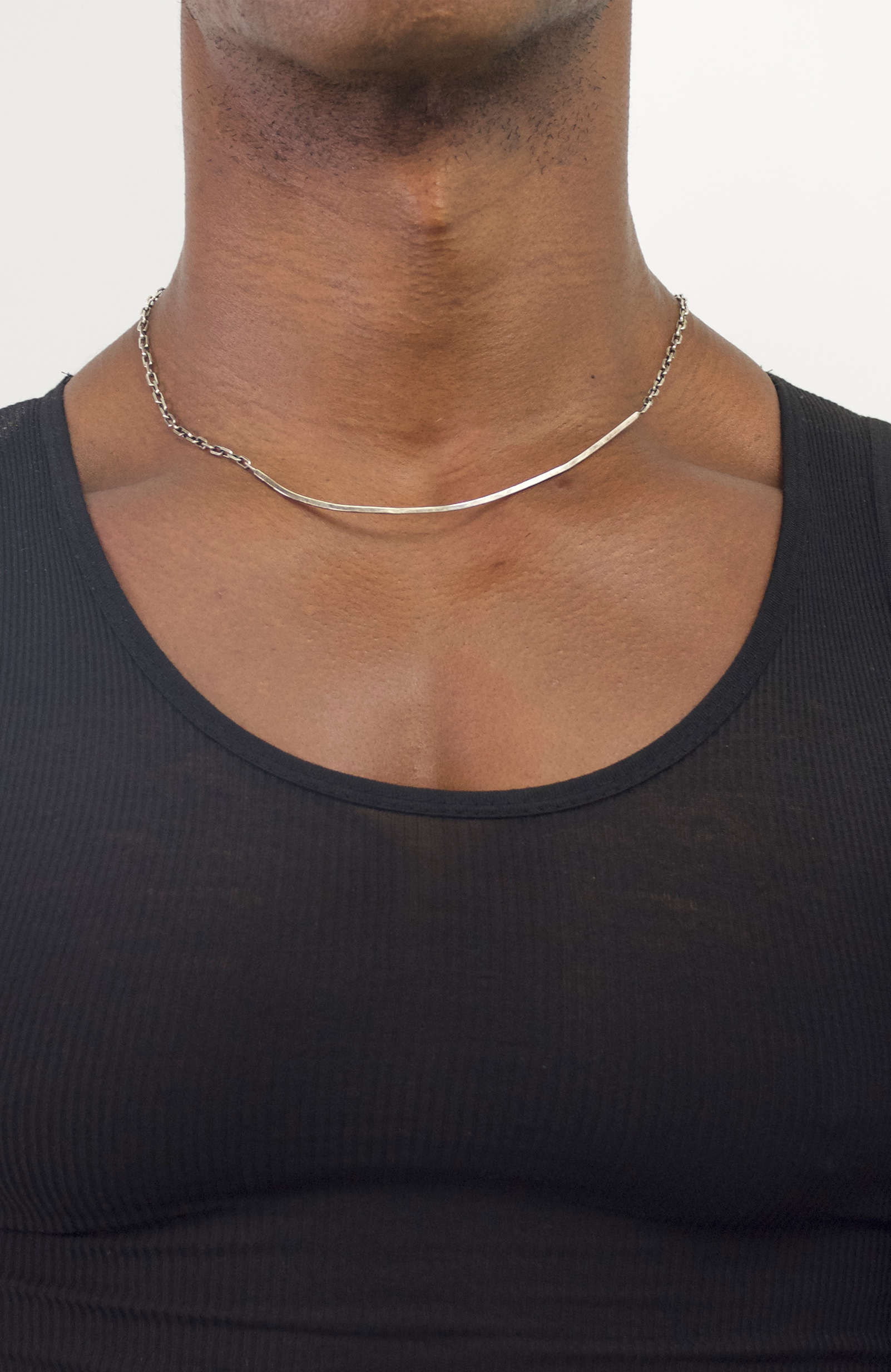 choker-length necklace features a prominent distressed 4" sterling silver bar between single strand anchor chains