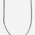 necklace is comprised of three separate chains including a thin double strand cable, more dense single strand cable and anchor chain, accented by an 18k yellow gold tube