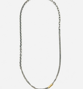 necklace is comprised of three separate chains including a thin double strand cable, more dense single strand cable and anchor chain, accented by an 18k yellow gold tube