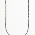 necklace features micro asymmetrical sterling chips and is finished with a single ruby and thumbprint detail