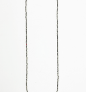 necklace features micro asymmetrical sterling chips and is finished with a single ruby and thumbprint detail