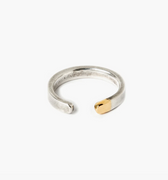 adjustable open ended sterling silver ring is finished with a chunk of 18k gold