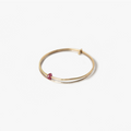 yellow gold double ring features a delicate ruby