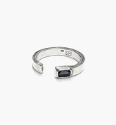 open signet ring is finished with an emerald-cut iolite stone