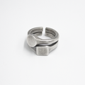 stacked open ring is made from reclaimed silver and features small circular and square signets that hug one another