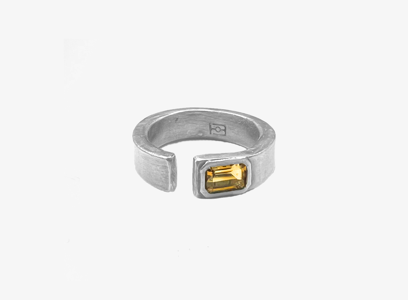 sterling silver open signet ring is hand forged and finished with an emerald-cut citrine stone