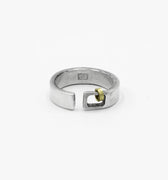 this adjustable, 6mm-wide hand-forged open sterling silver ring is accented with an 18k gold hoop